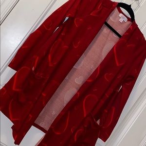 LulaRoe cardigan with front pockets. Long sleeve.